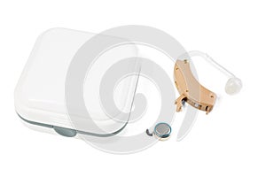 Hearing aid next to a white closed box on a white isolated background