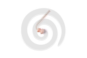 Hearing aid replacement eartip dome with silicone tube isolated on white background. Hearing aid accessories. Top view.