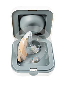 Hearing aid stands in a box on a white isolated background