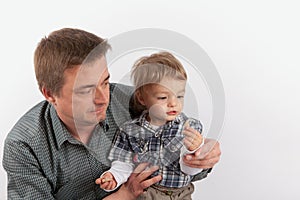 Hearing aids in the Family - Father showing his hearing aids to