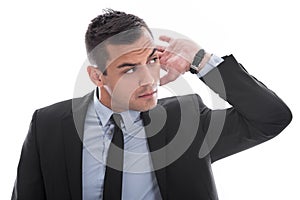 Hearing: attractive young business man listening to isolated on