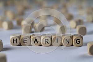 Hearing - cube with letters, sign with wooden cubes