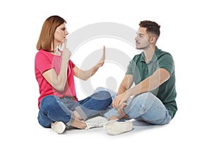 Hearing impaired friends using sign language for communication on white