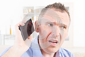 Hearing impaired man using mobile phone