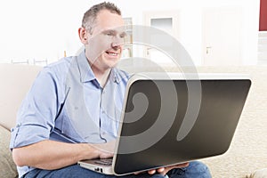 Hearing impaired man working with laptop