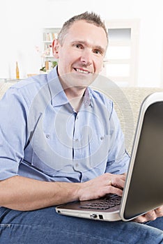 Hearing impaired man working with laptop