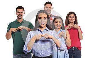 Hearing impaired people showing word FRIEND on sign language