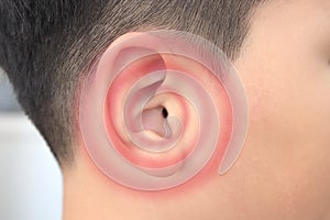 Hearing showing the ear of a boy human with sonic simulation technology