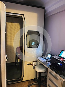 Hearing test booth in an audiology center. Audiometry, hearing screening photo