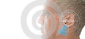 Hearing test showing ear of senior man with sound waves simulation technology