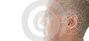 Hearing test showing ear of senior man with sound waves simulation technology