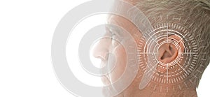 Hearing test showing ear of senior man with sound waves simulation technology photo
