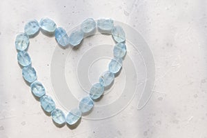 Heart from aquamarine. Blue heart from natural aquamarine. Romance, Valentine, Love. Copy space for your text