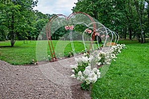 Heart arches pathway in park.