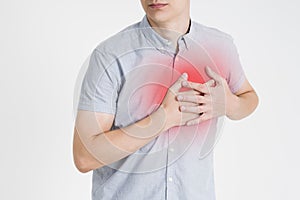 Heart attack, man with chest pain on gray background