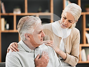 Heart attack, woman stress and senior couple at home with cardiology problem or stroke. House, marriage and retirement