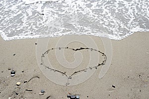 Heart on the background of the sea waves