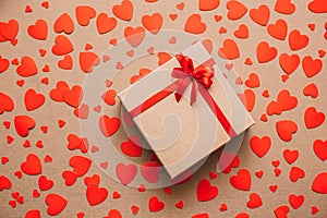 Heart background. Valentines day. Abstract paper hearts and gift box with red ribbon.