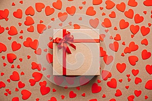 Heart background. Valentines day. Abstract paper hearts and gift box with red ribbon.
