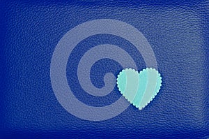 Heart on blue vintage leather background