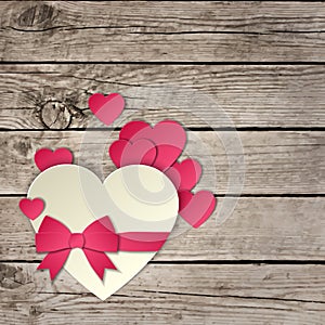 Heart with a bow on a wooden background vector