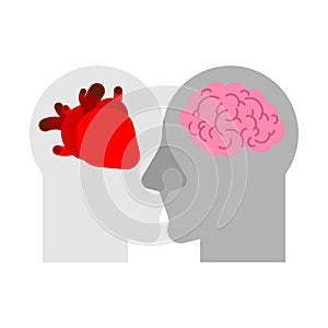 Heart and brain in two head. Mind or feelings concept