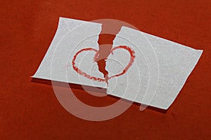 Heart break / broken heart symbol on red background.