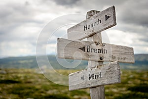 heart breath and mind text on wooden signpost outdoors