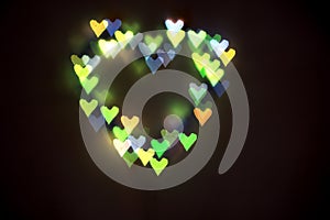 Heart of bright colored hearts-bokeh.Background for lovers