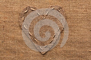 Heart of burlap, lies on a background of burlap