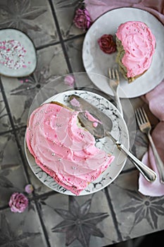 Heart cake with pink cream and confectionery toppings