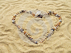 Heart from cockleshells and sea pebbles