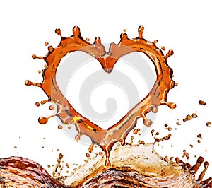 Heart from cola splash with bubbles isolated on white