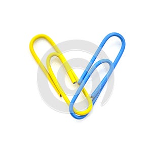 Heart of color paper clip isolated on white background