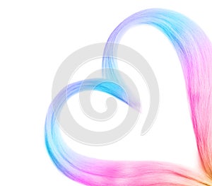 Heart of colorful dyed hair on white background