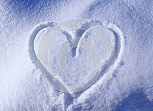 Heart contour drawn in the snow