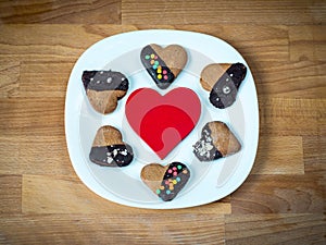 Heart cookies on a wooden brown background. Concept of Holiday Valentine`s Day or Christmas and New Year.