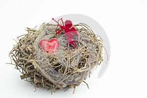 Heart and cupid figure placed into a wooden bird nest