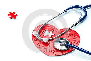 Heart disease, puzzle heart with stethoscope