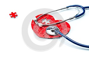 Heart disease, puzzle heart with stethoscope