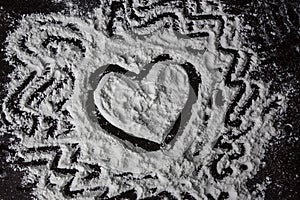 Heart drawing on the flour