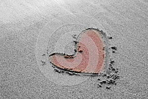 Heart drawing on the sand beach