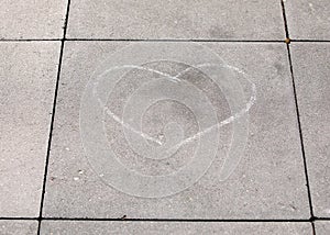 Heart - drawn with chalk on a pedestrian pavemen