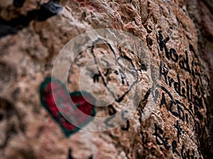 Heart drawn with a marker for a dedication on the wall near Juliet`s balcony, symbol of love and Valentine`s day