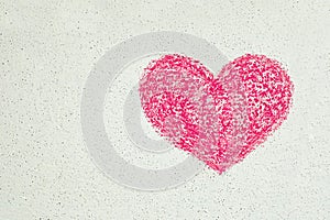 Heart drawn in red chalk on white wall