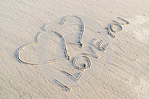 Heart drawn on sand