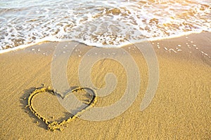 Heart drawn on the sand of a Sea beach
