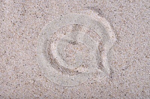 Heart drawn on sea sand, close up view