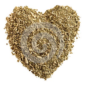 Heart of dry tea leaves with mate on white background isolate