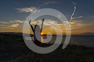 Heart fingers at the sunset in Zakynthos island